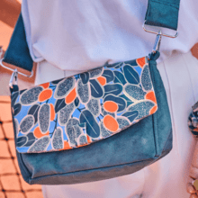 Flap of shoulder bag kumquat party