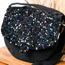 Flap of small shoulder bag purple black sequin