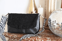 Flap of shoulder bag moumoute noire