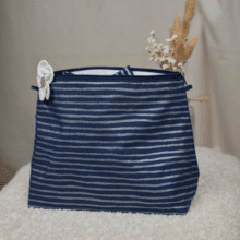 Cosmetic bag with flap striped silver dark blue