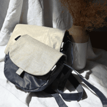 Flap of small shoulder bag golden linen